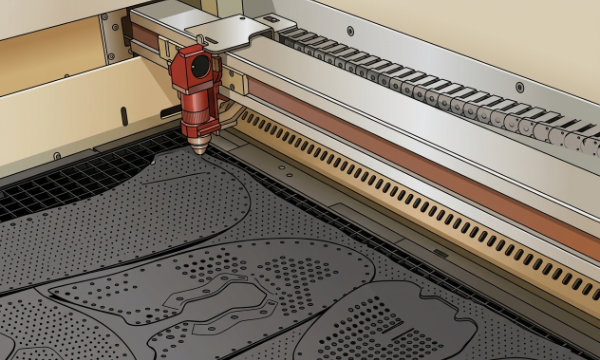 Laser cutter precisely cutting leather shoe upper pieces